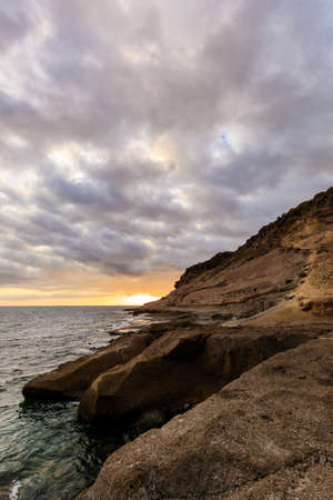 Summer seascape on tropical island Tenerife, Canary in Spain. Sunset in Costa Adejeの写真素材