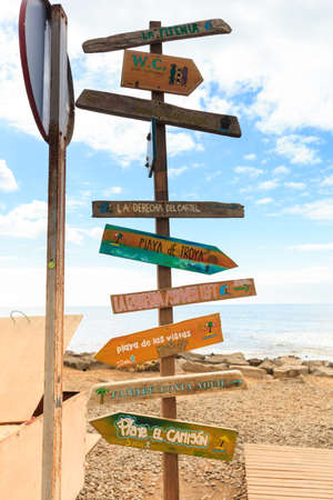 Oldschool guidepost on Las Americas Beach on summer seascape on tropical island Tenerife, Canary in...