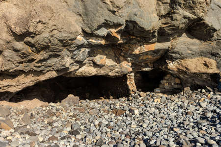 Summer landscape on tropical island Tenerife, Canary in Spain. Playa de San Juan beach full of rocks.の写真素材