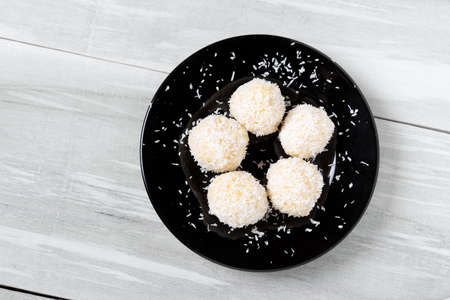 Homemade DIY natural vegan healthy millet gruel and coconut pralines with coconut oil and almond aromateの写真素材