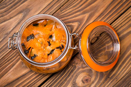 Homemade DIY natural vegan healthy salmon made of  carrot with nori algae a wooden table
