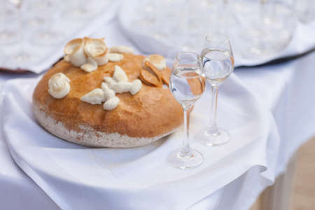 Wedding bread, salt and wodka detail - traditional polish inviting to Bride and Groom.の写真素材