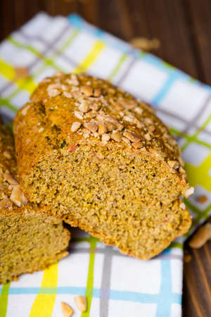 Homemade DIY natural vegan healthy pumpkin dry cake, bread like made with tomatoes, rosemary and...