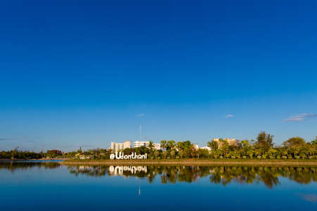 Beautiful view with reflex of name of the city monument taken in Udon Thani in northern Thailand. Cityscape with beautiful nature and architecture in south east Asia.の写真素材