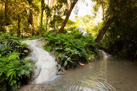 Paradise touristic Sticky Waterfall close to Chiang Mai in north Thailand. Beautiful asian nature during honeymoon.の写真素材