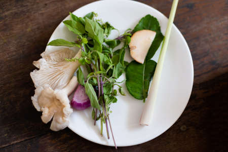 Thai spicy soup ingredients on plate. Picture of traditional thai cuisine made of fresh ingredients taken during cooking class in Chiang Mai.の写真素材