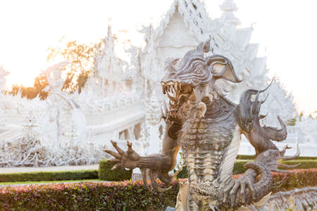 Beautiful buddhist Wat Rong Khun white temple in Chiang Rai in northern Thailand. Cityscape with...