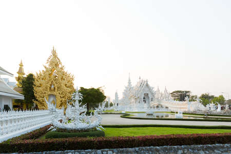 Beautiful buddhist Wat Rong Khun white temple in Chiang Rai in northern Thailand. Cityscape with beautiful religion architecture in south east Asia.のeditorial素材