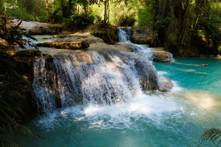 Amazing Kuang Si waterfall near touristic Luang Prabang in Laos. Landscape of nature in south east asia during summer.の写真素材