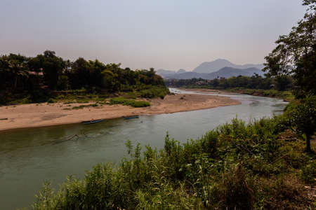Nam Khan river taken in touristic Luang Prabang in Laos. Colorful scenery of south east Asia.の写真素材