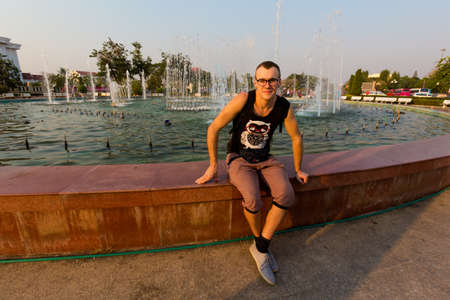 Tourist on French Patuxai victory monument in capital city Vientiane in Laos. History symbols of south east Asia.のeditorial素材