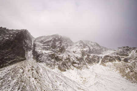 Beautiful Velicka valley - in slovakian High Tatra mountains. Beautiful panorama with autumn and winter together - path from Sliezsky Dom to Polsky Hreben (Polski Grzebien)の写真素材