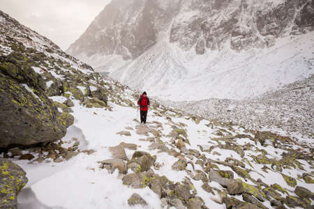 Beautiful Velicka valley - in slovakian High Tatra mountains. Beautiful panorama with autumn and winter together - path from Sliezsky Dom to Polsky Hreben (Polski Grzebien)の写真素材