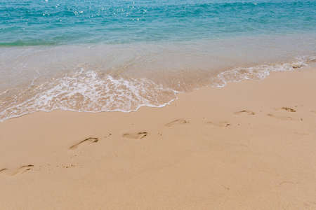 Summer landscape on tropical Koh Kood island in Thailand. Footprints on sand and landscape with sea taken from Ao Tapao beach.の写真素材