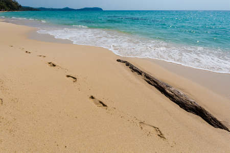 Summer landscape on tropical Koh Kood island in Thailand. Footprints on sand and landscape with sea...