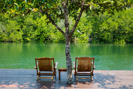 Summer landscape on tropical Koh Kood island in Thailand. Panorama with sunbeds on Klong Chao.の写真素材