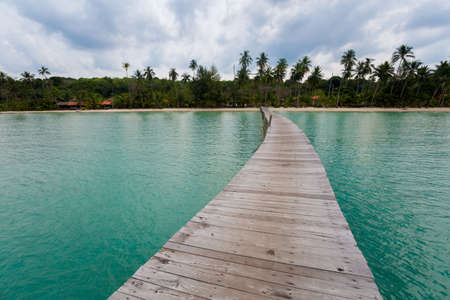 Summer landscape on tropical koh Kood island in Thailand. Landscape with long wooden pier taken on Bang Bao beach.の写真素材