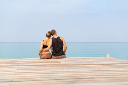 Summer landscape on tropical koh Kood island in Thailand. Landscape with young caucasian couple taken on Bang Bao beach.の写真素材