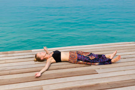 Summer landscape on tropical koh Kood island in Thailand. Landscape with young caucasian sexy woman taken on Bang Bao beach.の写真素材