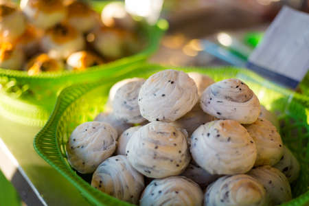 Fresh prepared asian fresh buns with topping on local market. Traditional thai cuisine made of fresh...