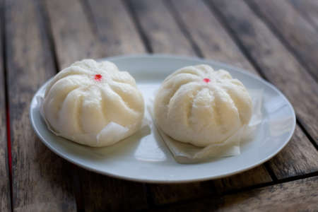 Fresh prepared asian steamed buns on local market. Traditional thai cuisine made of fresh ingredients.の写真素材