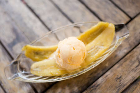 Fresh prepared asian vanilla icecream with fried banana dessert. Traditional thai cuisine made of fresh ingredients.の写真素材