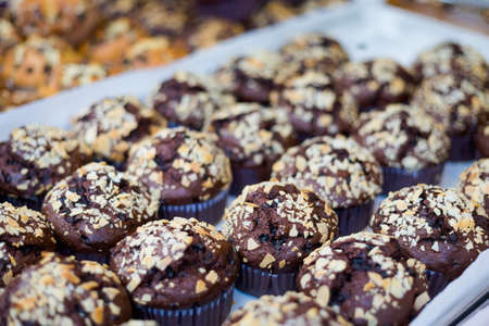 Fresh prepared asian cupcake muffins with chocolate chips. Traditional thai sweets made of fresh ingredients.の写真素材