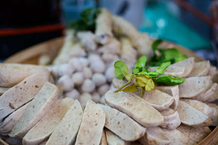 Fresh prepared asian minced white pork sausage Moo Yor on local market. Traditional thai cuisine made of fresh ingredients.の写真素材
