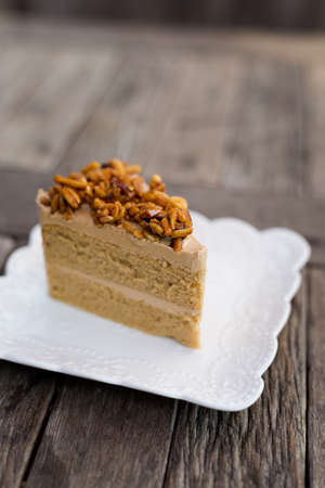 Fresh prepared slice of asian almond coffee cake served in local restaurant. Traditional thai sweets...