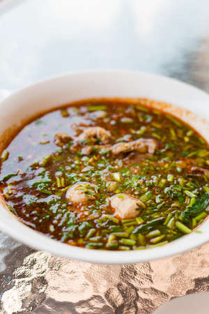 Fresh made lao minced pork red soup. Traditional lao cuisine.