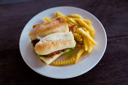Fresh prepared asian crispy pumpkin baguette sandwich with deep fried chips. Traditional lao cuisine made of fresh ingredients.の写真素材