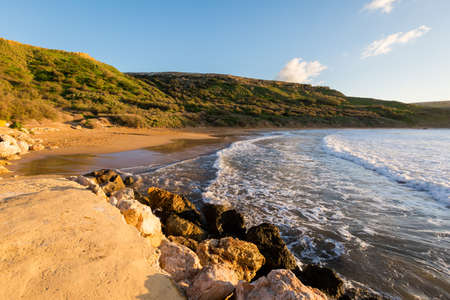 Beautiful Ghajn Tuffieha Bay taken during colorful sunset on Malta island. Beautiful landscape in south Europe.の写真素材