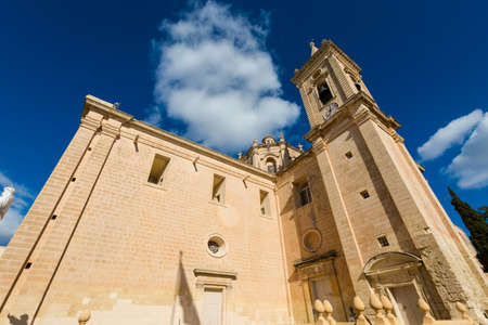 Beautiful sandstone sacral architecture of the Parich Church in Balzan city on Malta island. Beautiful cityscape in south Europe.の写真素材