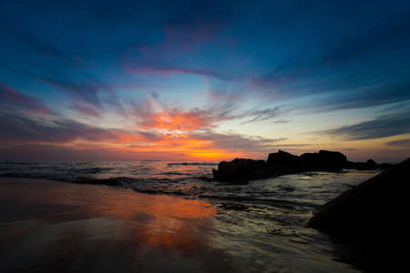 Beautiful sunset on tropical island Koh Kradan in Thailand. Landscape taken on sunset coral reef beach with sun going downの写真素材