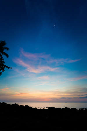 Summer sunset on tropical koh Lanta  island in Thailand. Landscape taken on Long Beach with blue skyの写真素材