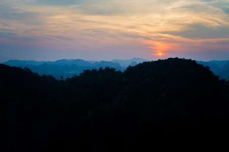 Beautiful buddhist tiger cave temple - watham sua - footprint of the buddha in Krabi in southern Thailand during sunset. Cityscape with beautiful religion architecture in south east Asia.の写真素材