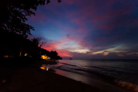 Sunset landscape on tropical Tioman island in Malaysia. Beautiful night seascape of south east asia on Tekek beach.の写真素材