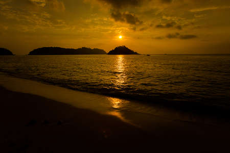 Teluk Nipah coral beach on Pangkor island in Malaysia. Beautiful landscape with sea  taken during golden sunset in south east Asia.の写真素材