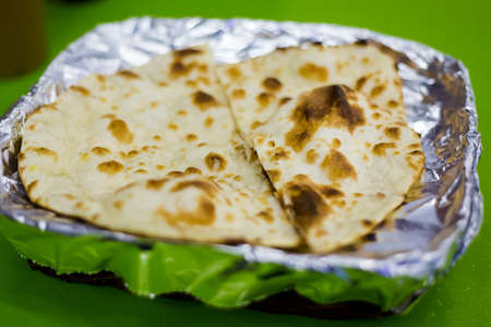 Naan bread in an aluminium foil, a South east Asia local dish.