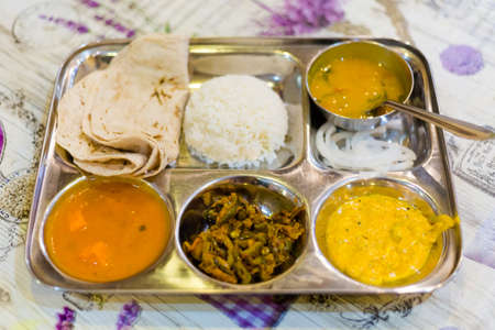 Fresh prepared spicy indian food selection in local restaurant in Bangkok. Traditional asian cuisine...