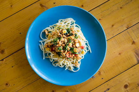 Fresh prepared asian spicy minced meat spaghetti served in local restaurant on Koh Mook island. Traditional thai cuisine made of fresh ingredients.の写真素材