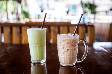Fresh prepared sweet ice cold thai milk and green tea in local restaurant in Krabi town. Traditional thai cuisine made of fresh ingredients.の写真素材