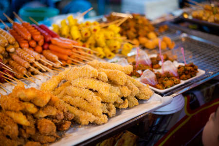 Fresh asian spicy crispy chicken strips bites on local market in Krabi. Traditional thai cuisine made of fresh ingredients.の写真素材
