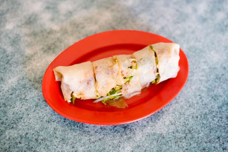 Fresh prepared malaysian spring roll Poh Piah pancake served in local restaurant in Malacca. Traditional asian cuisine made of fresh ingredients.の写真素材