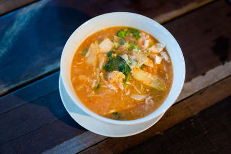 Fresh prepared malaysian Mee Bandung noodle soup served in local restaurant on Pangkor island. Traditional asian cuisine made of fresh ingredients.の写真素材