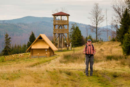 Autumn landscape with tourists taken in polish Beskidy mountains, Grabowa.の写真素材