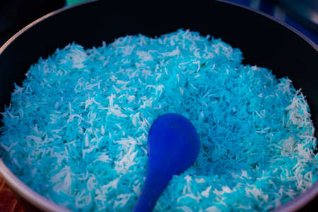 Fresh prepared malaysian blue rice nasi kerabu on local market on Langkawi island. Traditional asian cuisine made of fresh ingredients.の写真素材