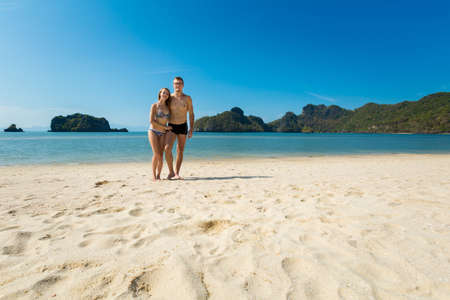 Tourist on sunny Tanjung Rhu beach on tropical Langkawi island in Malaysia. Beautiful nature of south east asia.の写真素材