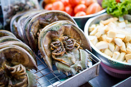Fresh raw crabs on local market in Trang. Traditional thai dish made of fresh ingredients.の写真素材