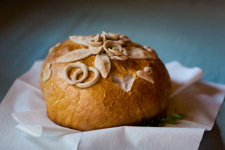 Wedding bread with salt detail on hands- traditional polish inviting to Bride and Groom.